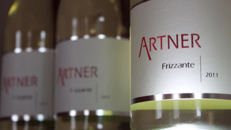 Wine bottles, © Weingut Artner Close-up of wine bottles with the label 'Artner Frizzante 2011'.