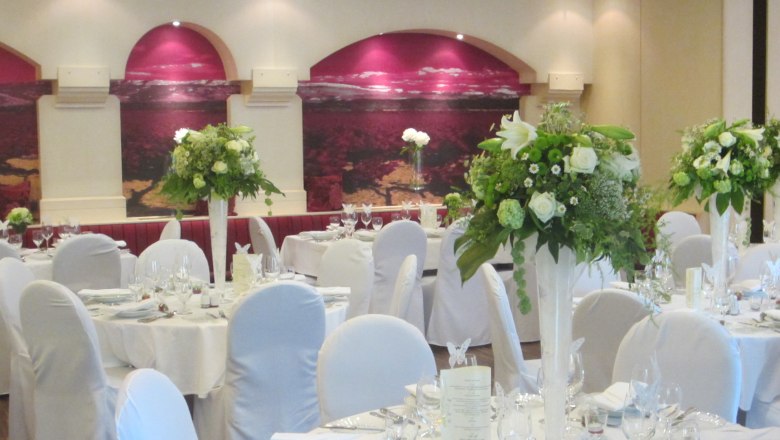 Hall, © Landgasthaus Hotel Muhr Elegant banquet hall with white-clothed tables and flower arrangements.