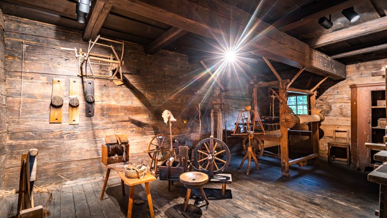 Krumbach Museum Village, © Wiener Alpen, Christian Kremsl Interior view of an old workshop with wooden tools and spinning wheels in the Krumbach museum village.