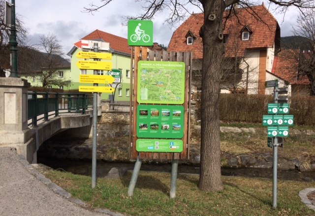 Kirchberg bike start sign, © ©Wiener Alpen Bicycle starting point board in Kirchberg with signposts and map.