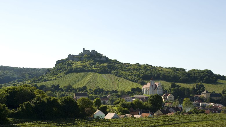Falkenstein castle ruins, © Michael Himml Landscape with castle on a hill, vineyards and village with church in the foreground.