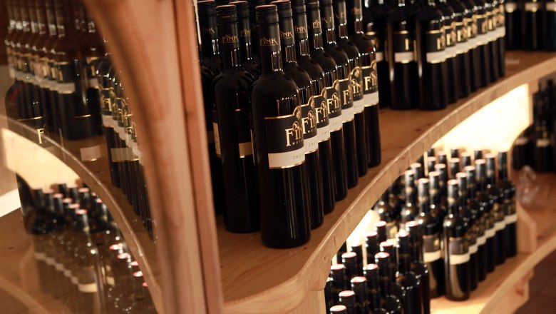Fink Winery, © weinfranz.at Shelves with wine bottles at the Fink winery.