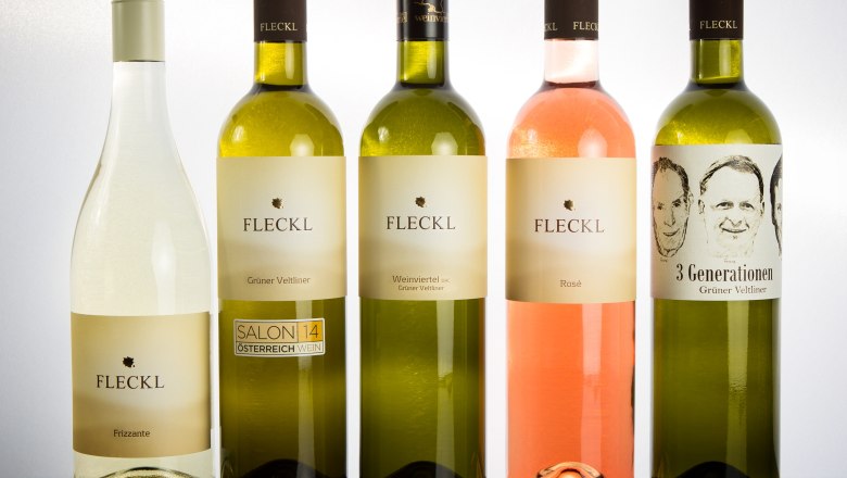Wine assortment, © Alexander Fleckl Five bottles of Fleckl brand wine, including Frizzante, Grüne Veltliner and Rosé.