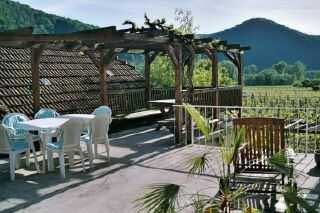 Terrace, © Emmerich Granner Terrace with pergola, table and chairs, surrounded by mountains and vineyards.