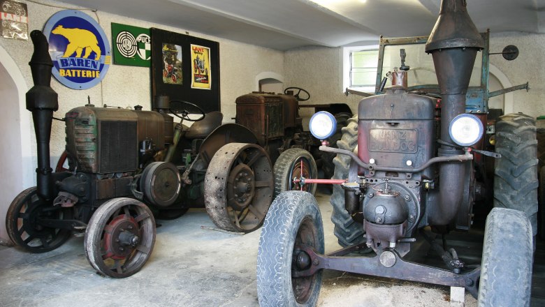 Museum2, © Fam. Buchinger Old tractors on display in a museum.