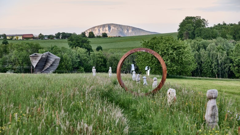 Good gas part, © Nina Nagy Photography Sculpture park with works of art and mountain in the background.