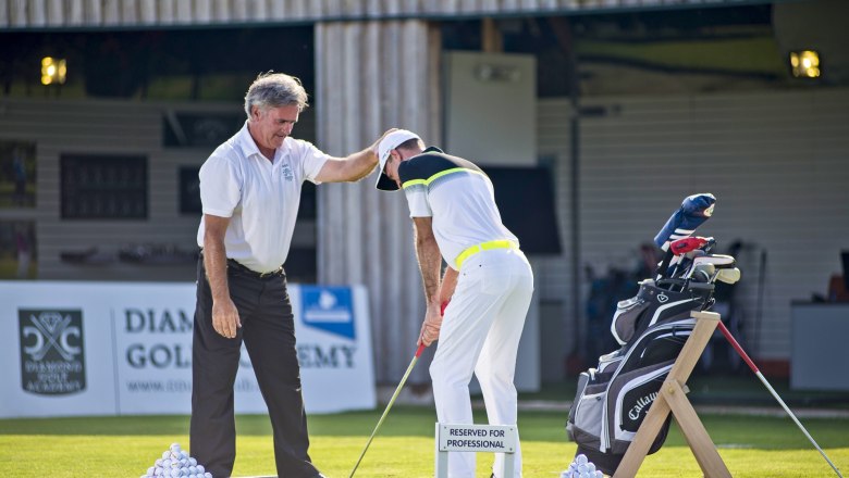 Diamond Golf Academy, © DCC A golf instructor gives instructions to a student on a practice course at the Diamond Golf Academy.