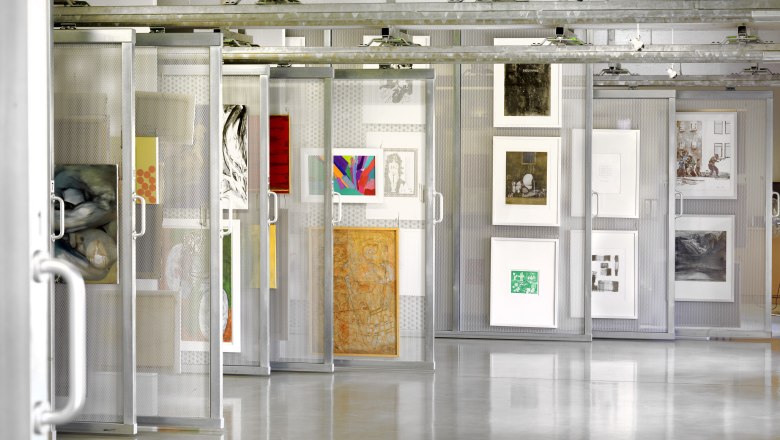 Artotheque, © Birgit und Peter Kainz Interior view of an art library with works of art on movable shelves.