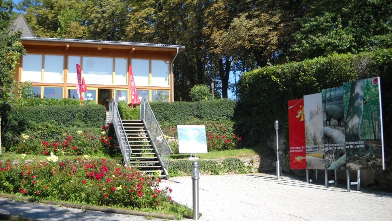 Sparbach Nature Park, © Naturpark Sparbach Entrance to Sparbach Nature Park with steps, flowerbeds and information boards.