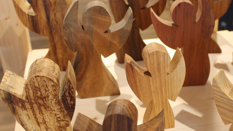 angel, © Johann Peham Wooden angel on a table in a store.