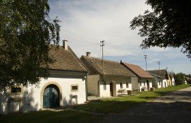 Wine cellar lane in Schöngrabern, © Rita Newman Row of wine cellars in Schöngrabern, Austria, in sunny weather.