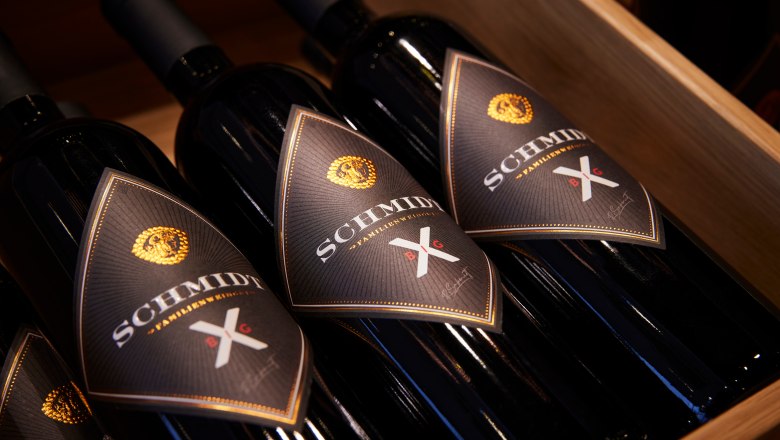 Wine bottles, © Ben Leitern Three Schmidt brand wine bottles in a wooden box.