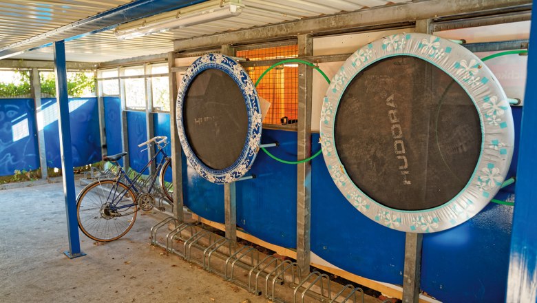 Bicycle garage, © Christoph Sammer Bicycle garage with trampolines on the wall.