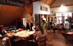Museum of local history Kautzen, © Heimatmuseum Kautzen Interior view of a local history museum with people in traditional clothing showing handicrafts.