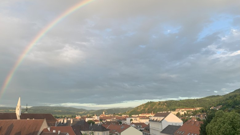 View of Krems and Stein, © kremsoase City view of Krems with rainbow in the sky.