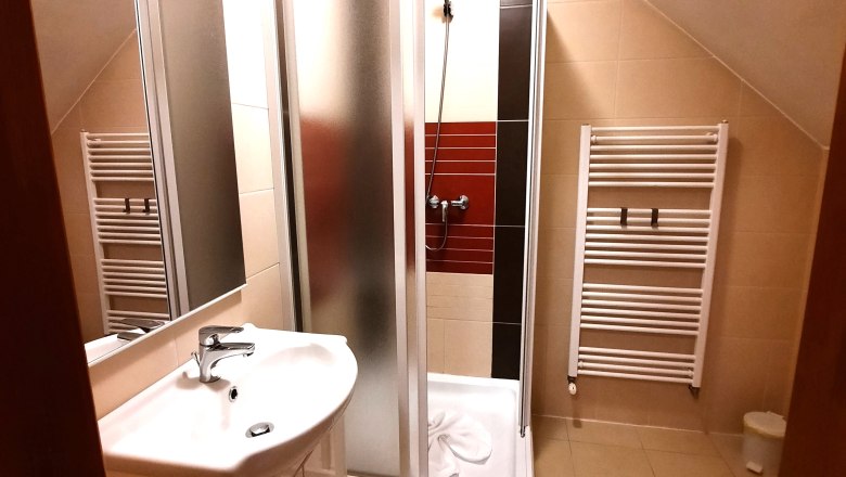 Bathroom, © Ildiko Davidne Nagy Modern bathroom with shower, washbasin and towel radiator.