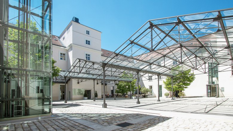 Hotel Altes Kloster, © Altes Kloster Inner courtyard of the Hotel Altes Kloster with glass roof and modern design.