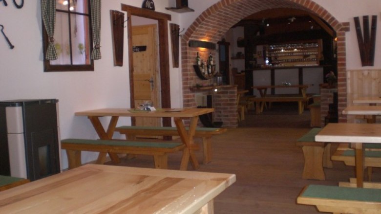 In the wine tavern, © Gass Interior view of a traditional wine tavern with wooden tables and benches.