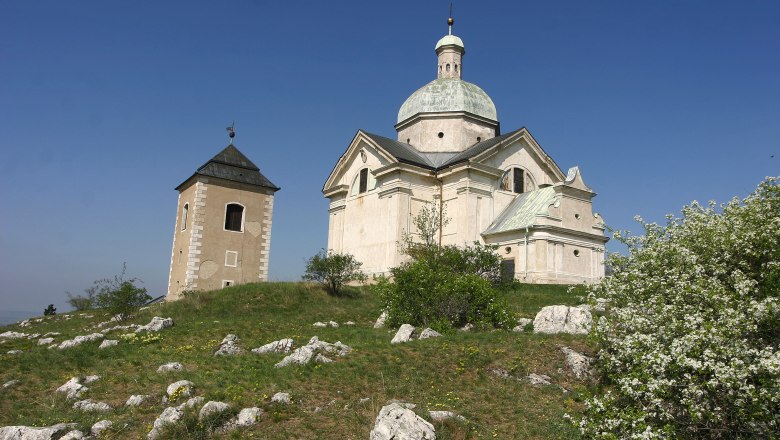 Holy mountain, © Turistické informacní centrum Mikulov Chapel on a hill with blue sky in the background.