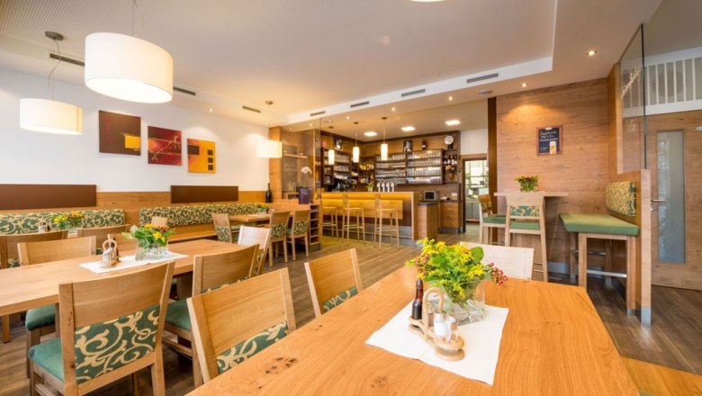 Bauer Inn, © Bauer Interior view of a cozy inn with wooden furniture and bar.