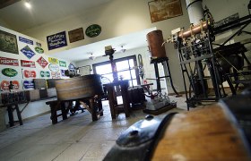 Wieselburg Brewery Museum, © Brauereimuseum Wieselburg Interior view of the Wieselburg Brewery Museum with old brewing equipment and signs.