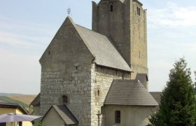 Fortified church, © Wolf Historic fortified church with stone tower and pointed roof.