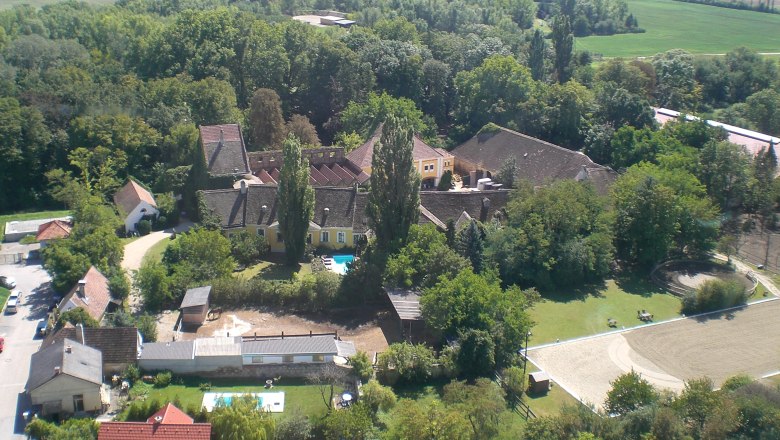 Fabricius Manor Riding Stables, © rgf Aerial view of a riding stable with buildings, trees and riding arena.