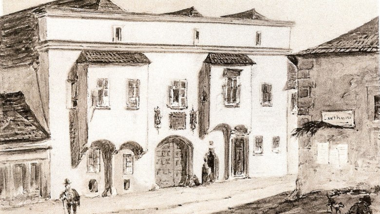 Hafnerhaus according to Huts, © Museum Mödling Historical drawing of a building with round arches and windows, two people standing in front of it.