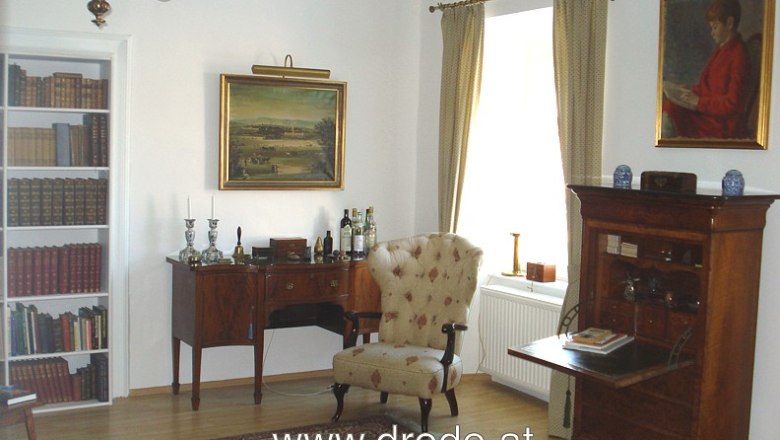 Living room, © C. Wardell Classic living room with antique furniture, paintings and bookshelf.