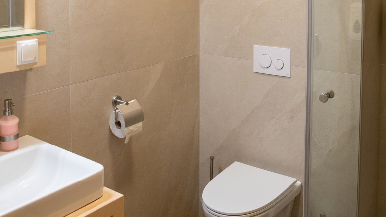 Bathroom, © Nadine Beles Modern bathroom with washbasin, toilet and shower cubicle.
