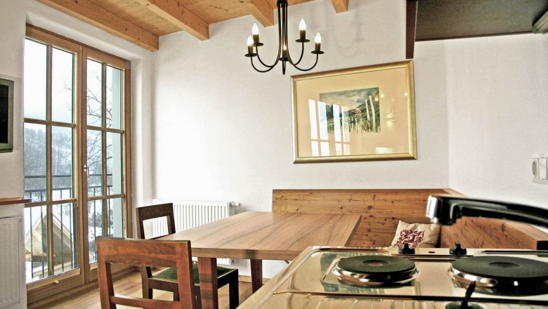 Guest rooms Polz Winery, © Weingut Polz Cozy guest room with wooden furniture and kitchenette.