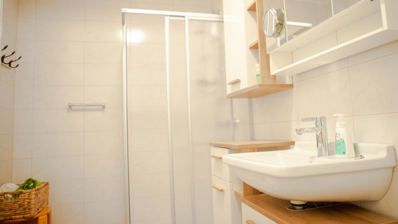 Bathroom, © Michael Sokolar Modern bathroom with shower, washbasin and mirror.