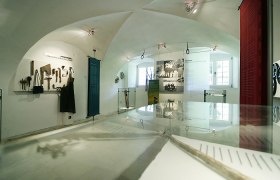Brotherhood of St. Anton an der Jeßnitz, © Bruderlade St. Anton an der Jeßnitz Interior view of a museum with tools and historical photos.