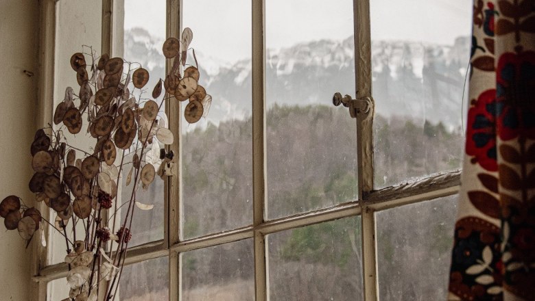 Orlet on the Rax, © Sofia Orlet View from a window with mountain landscape in the background, vase with dried flowers in the foreground.