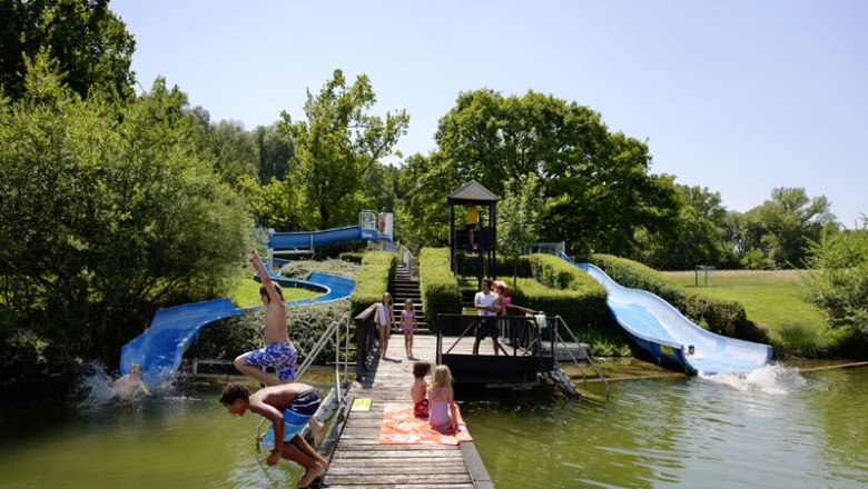 Slide at the Aubad Tulln, © Alexander Haiden Children play on water slides at the Aubad Tulln.
