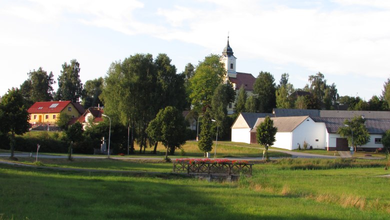 Haugschlag town center, © Gemeinde Haugschlag Rural scene with church and houses in Haugschlag.