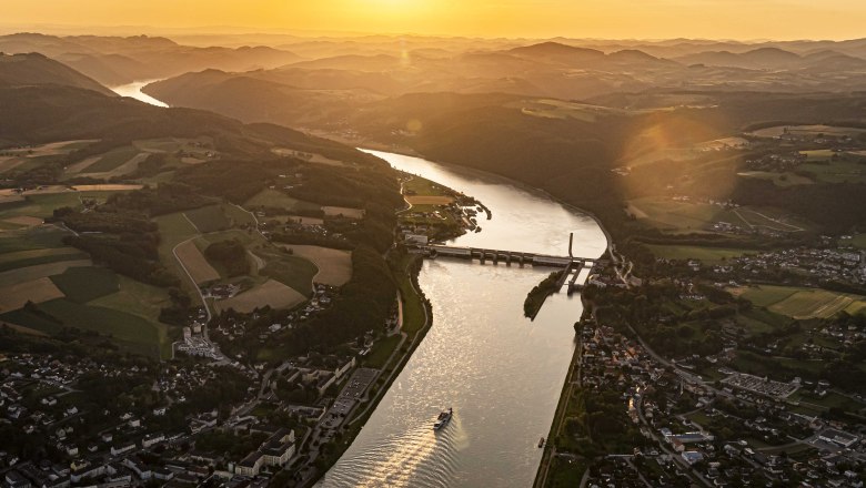 View of the Danube power plant, © Robert Herbst Aerial view of a river with a power station at sunset.