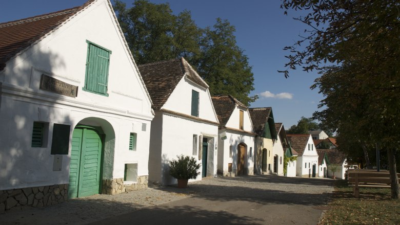 Mailberg, © Herbert Weil Row of traditional wine cellars in Mailberg, Austria, in sunny weather.