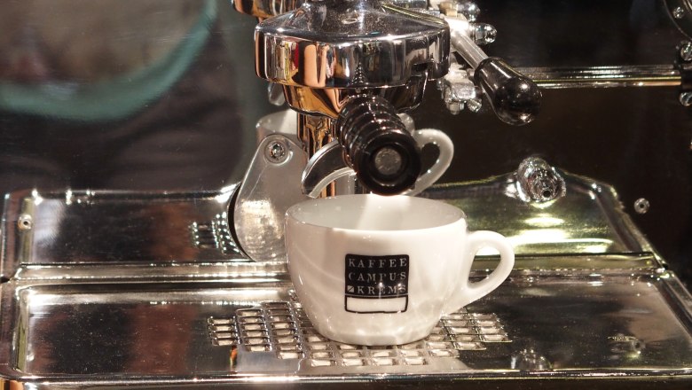 Coffee enjoyment, © Donau Niederösterreich Espresso machine with cup that brews coffee.