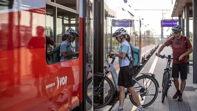 Station, © Erwin Haiden Two people with bicycles board a train.