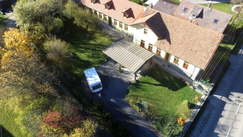 Garden and the vacation apartments at the back of the house, © dmgrauszer Aerial view of a house with garden and vacation apartments at the back.