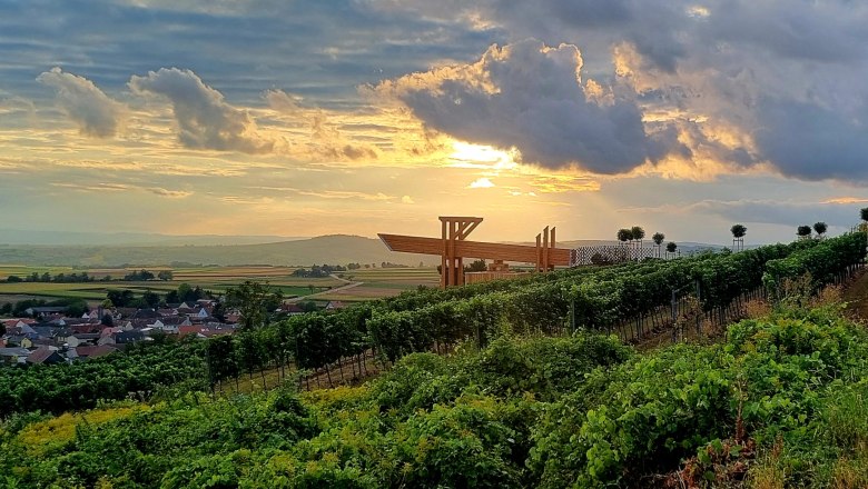 Wine view terrace, © Gemeinde Russbach Vineyards at sunset with modern terrace in the background.