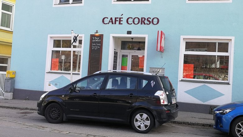 Cafe Corso, © Roman Zöchlinger Exterior view of Café Corso with parked car in front.