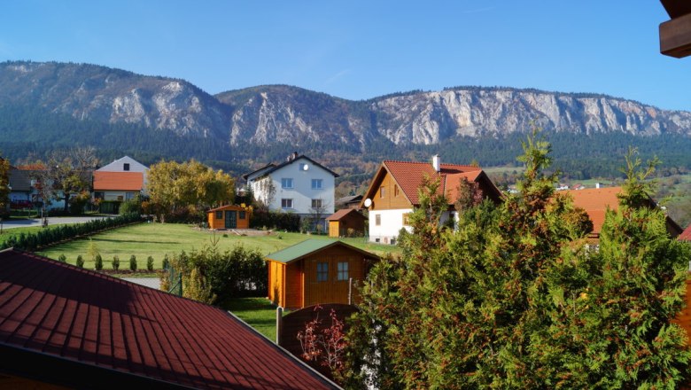 View from the panoramic staircase, © Reep View of a village with mountains in the background and blue sky.