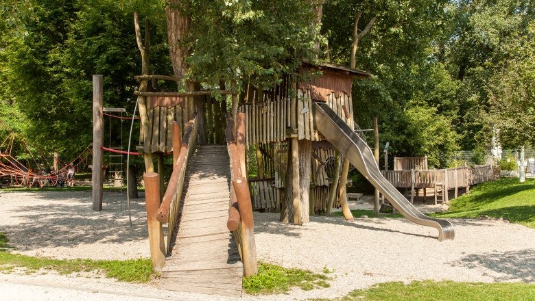 Adventure and nature playground, © Helmut Kail Adventure and nature playground with wooden bridge and slide.