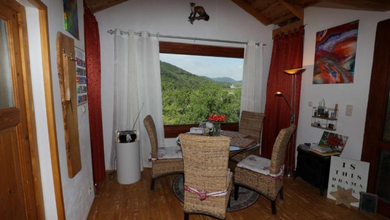 Indoor tree house, © Familie Feiertag Chairs with table in front of a window