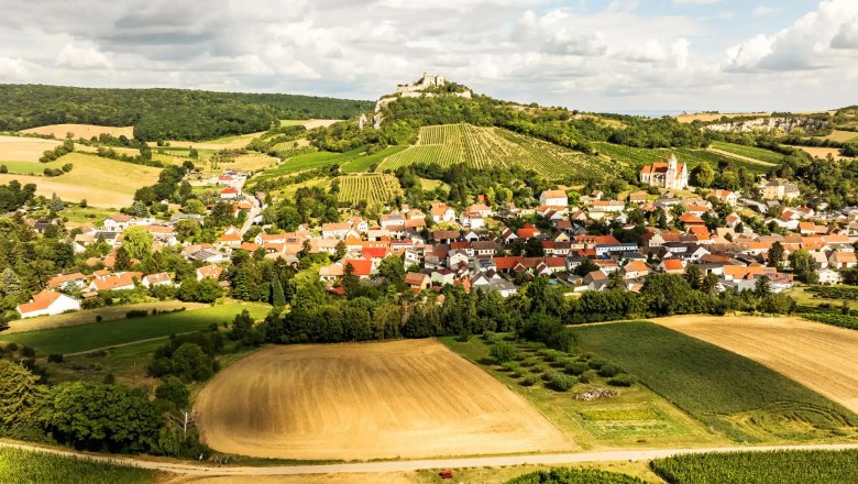 Vacation in Falkenstein, © Robert Herbst Aerial view of Falkenstein with fields, vineyards and a castle on a hill.