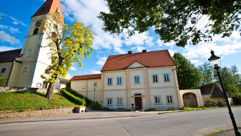 Zuschmann vicarage, © Horst von Bohlen Zuschmann vicarage with church and blue sky.