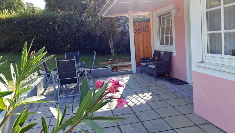 Terrace, © Barbara Muck Terrace with garden furniture and pink house facade.