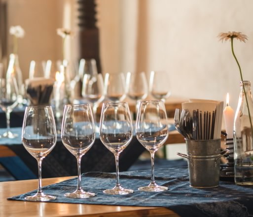 In the wine cellar, © Petr Blaha Table with wine glasses and candles in a cozy room.